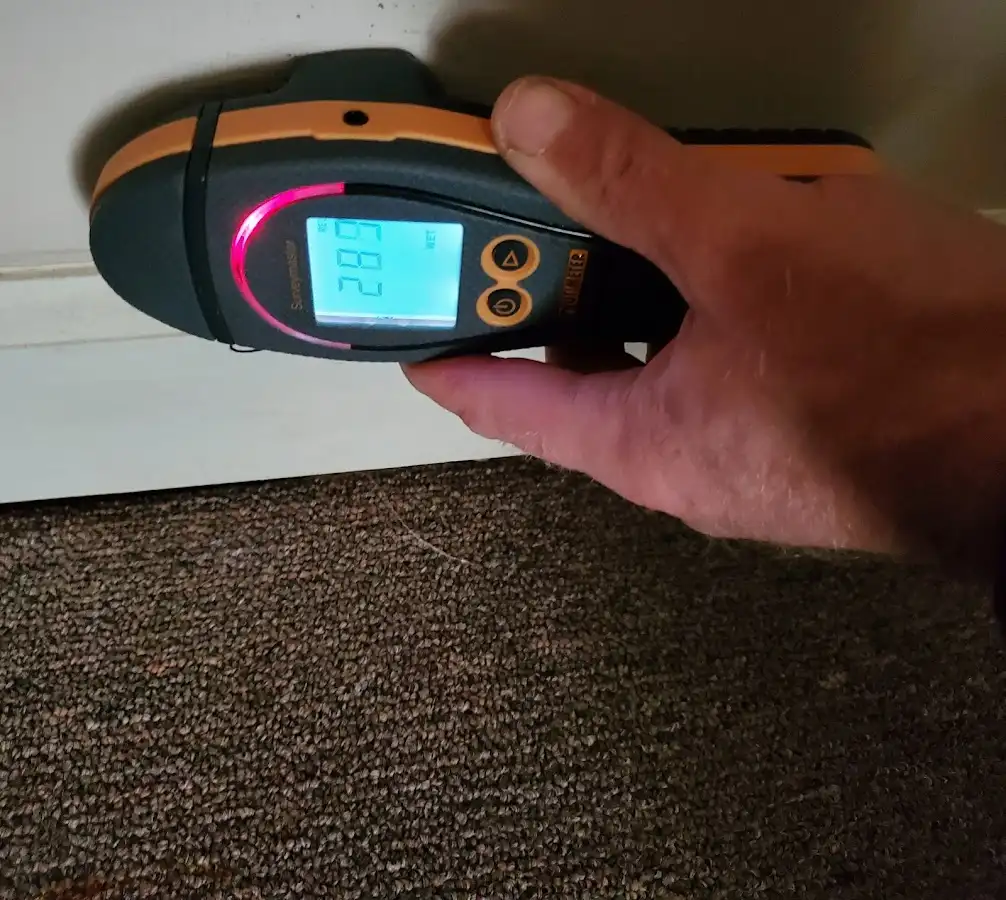 Moisture detection at baseboard during Burst Pipe Cleanup in Concord